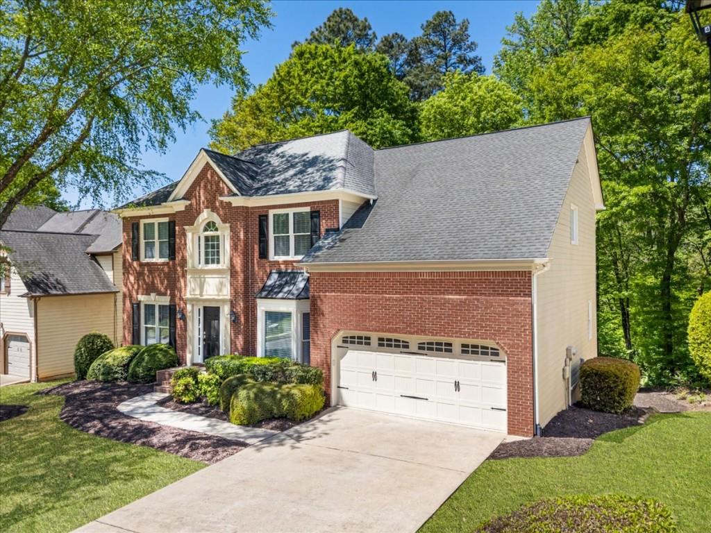 1110 Compass Pointe Crossing Alpharetta, GA 30005 - Photo 2 of 55 a aerial view of a house with a yard and potted plants