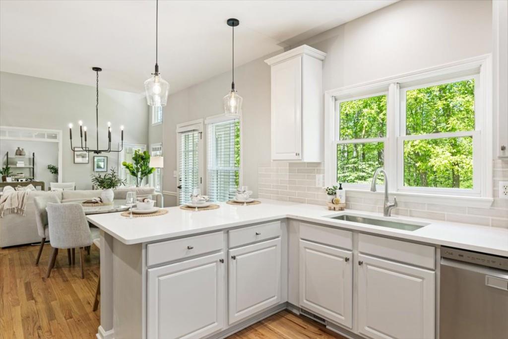 1110 Compass Pointe Crossing Alpharetta, GA 30005 - Photo 24 of 55 a kitchen with a sink window and cabinets