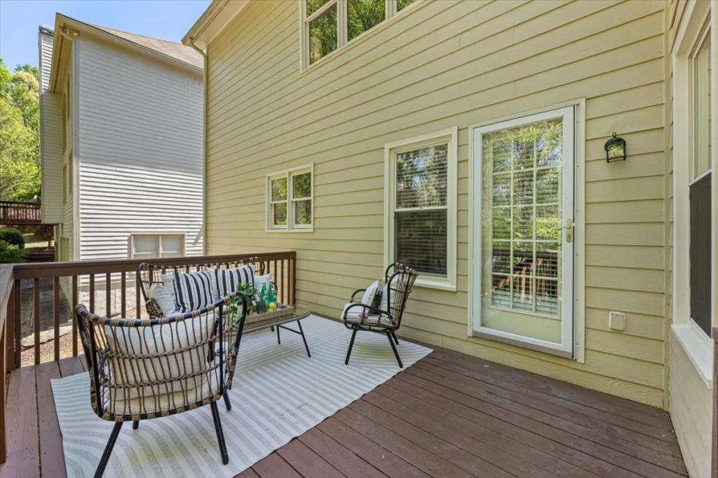 1110 Compass Pointe Crossing Alpharetta, GA 30005 - Photo 25 of 55 a view of a wooden chairs on the deck