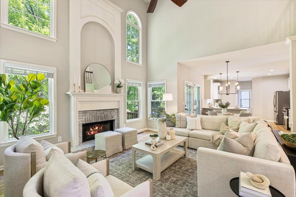 1110 Compass Pointe Crossing Alpharetta, GA 30005 - Photo 3 of 55 a living room with furniture and a fireplace
