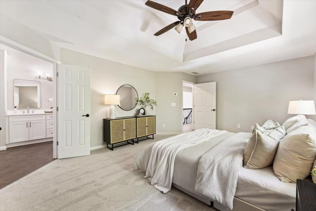 1110 Compass Pointe Crossing Alpharetta, GA 30005 - Photo 32 of 55 a bedroom with a bed and a chandelier