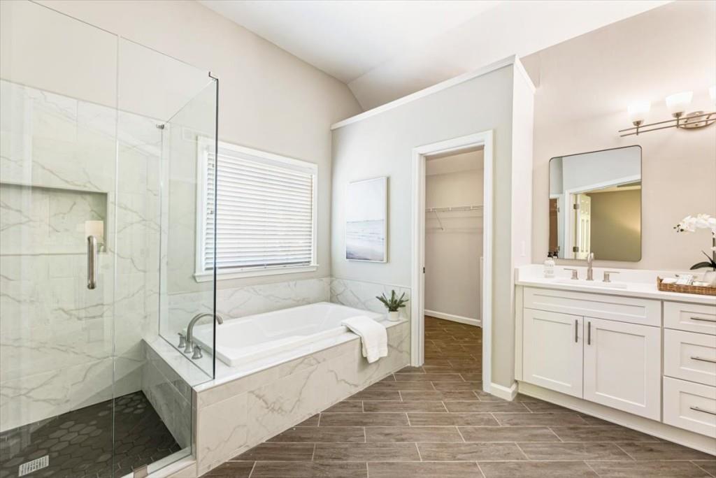 1110 Compass Pointe Crossing Alpharetta, GA 30005 - Photo 33 of 55 a bathroom with a tub a sink and a mirror