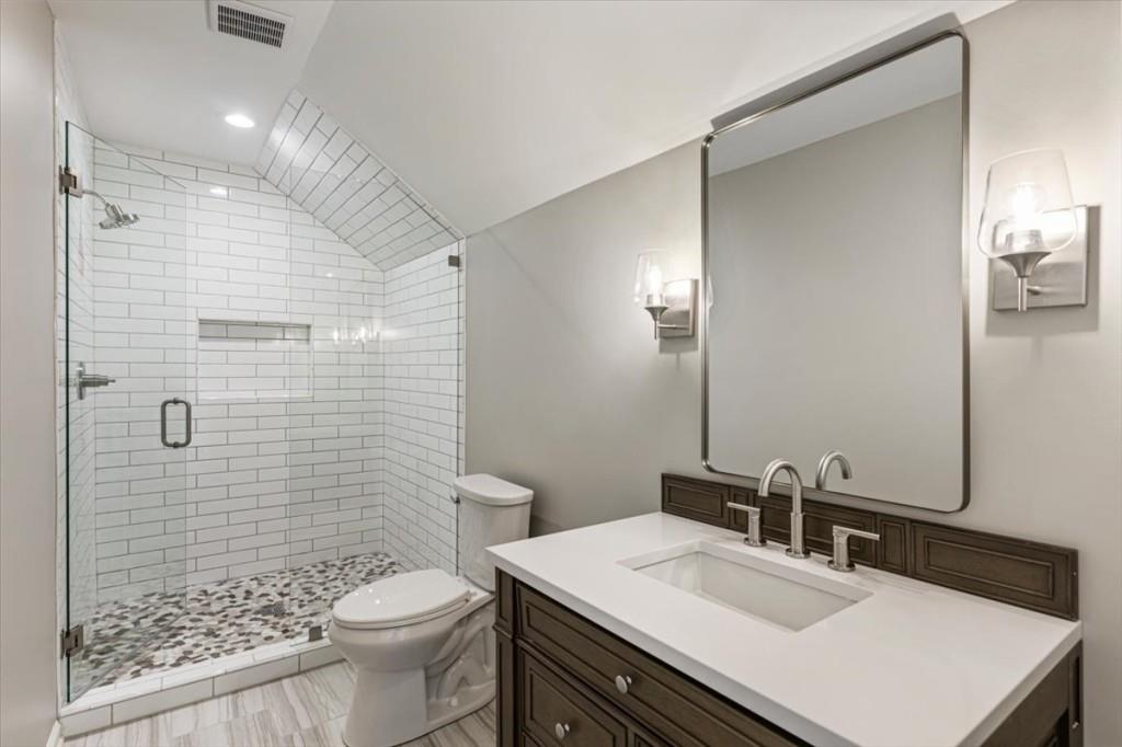 1110 Compass Pointe Crossing Alpharetta, GA 30005 - Photo 38 of 55 a bathroom with a sink toilet vanity and shower