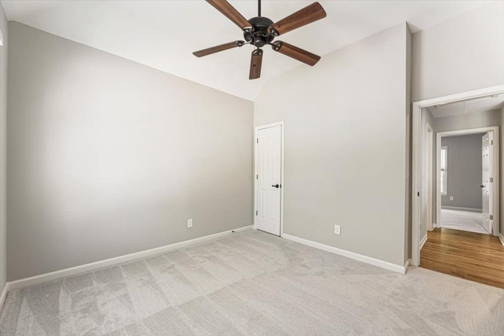 1110 Compass Pointe Crossing Alpharetta, GA 30005 - Photo 39 of 55 an empty room with a fan and a ceiling fan
