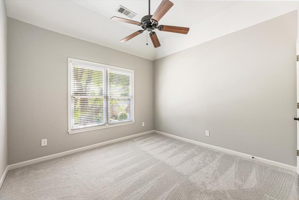 1110 Compass Pointe Crossing Alpharetta, GA 30005 - Photo 40 of 55 an empty room with window and fan