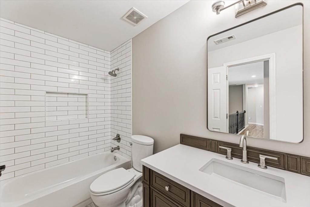 1110 Compass Pointe Crossing Alpharetta, GA 30005 - Photo 41 of 55 a bathroom with a sink a toilet and shower