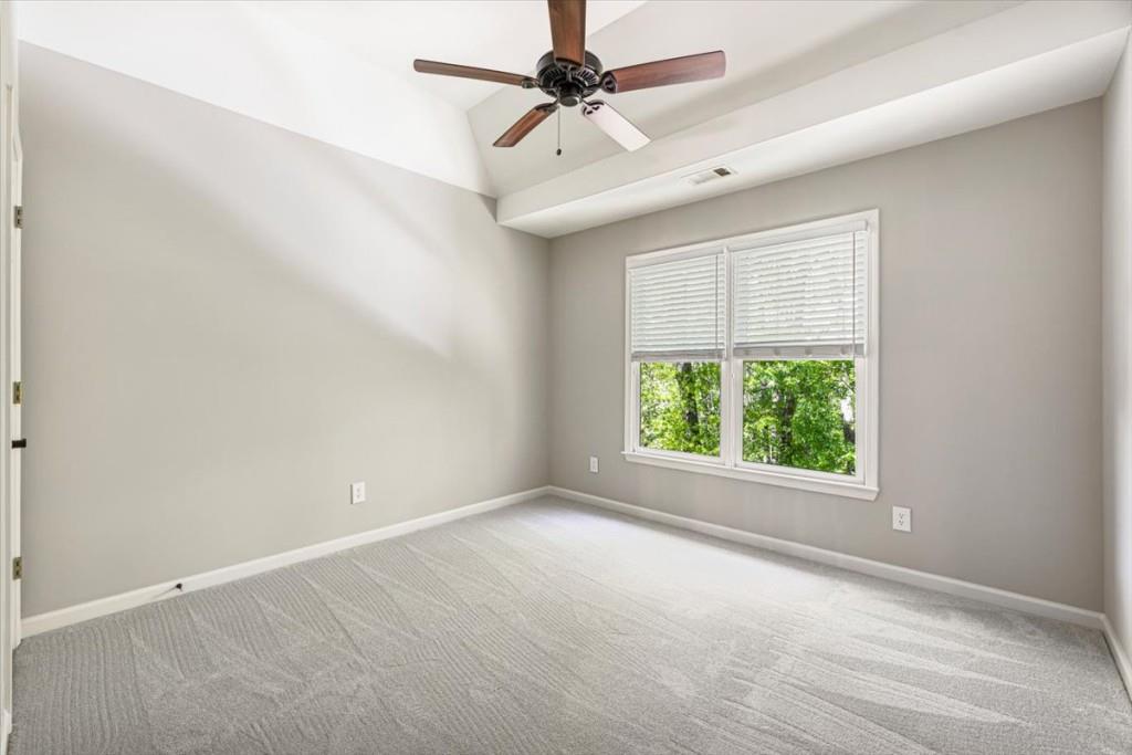 1110 Compass Pointe Crossing Alpharetta, GA 30005 - Photo 43 of 55 an empty room with windows and fan