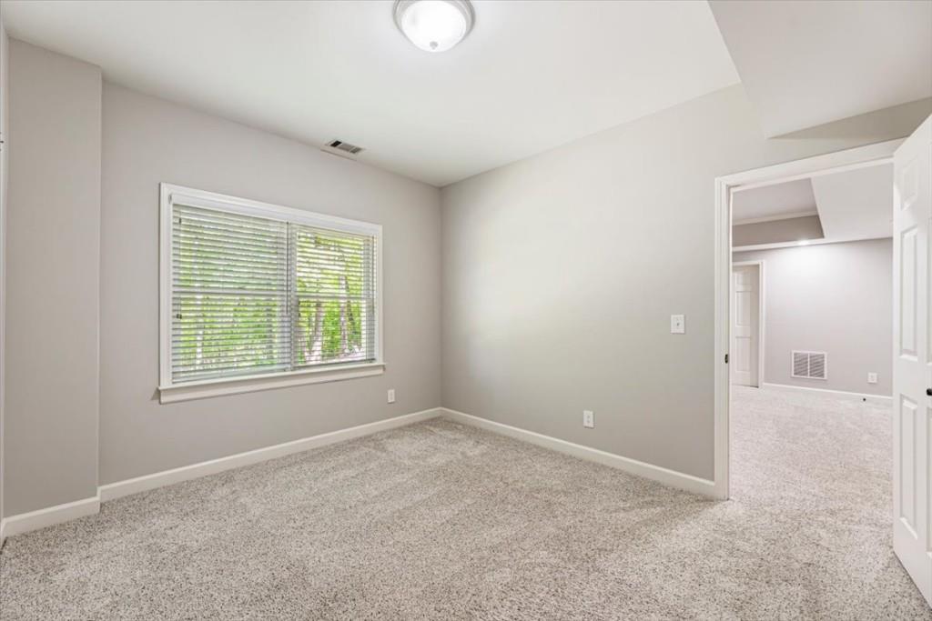 1110 Compass Pointe Crossing Alpharetta, GA 30005 - Photo 47 of 55 an empty room with windows and closet