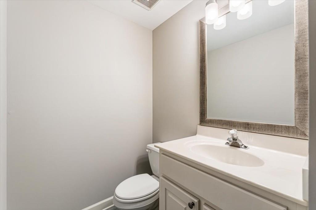 1110 Compass Pointe Crossing Alpharetta, GA 30005 - Photo 48 of 55 a bathroom with a sink a toilet and mirror