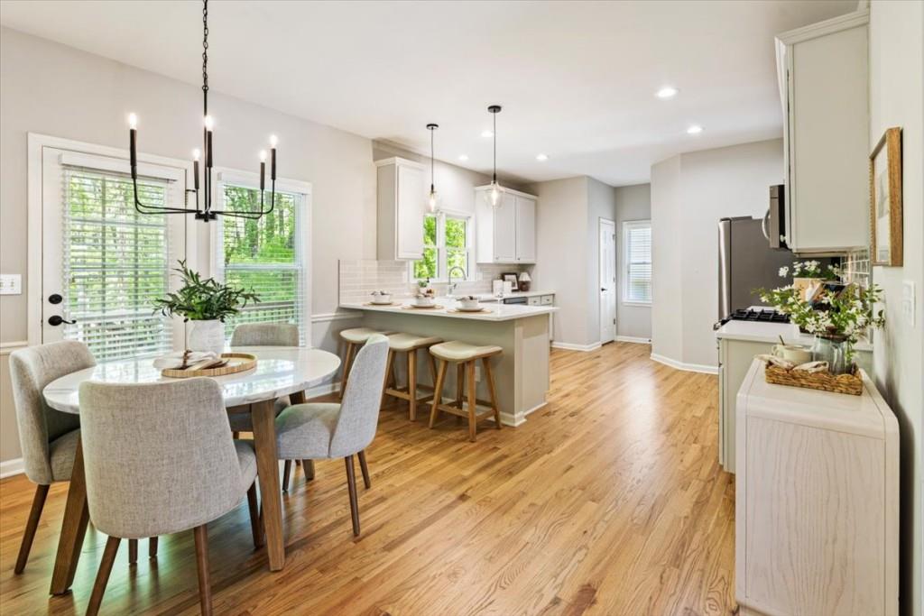 1110 Compass Pointe Crossing Alpharetta, GA 30005 - Photo 5 of 55 a view of a dining room with furniture window and outside view