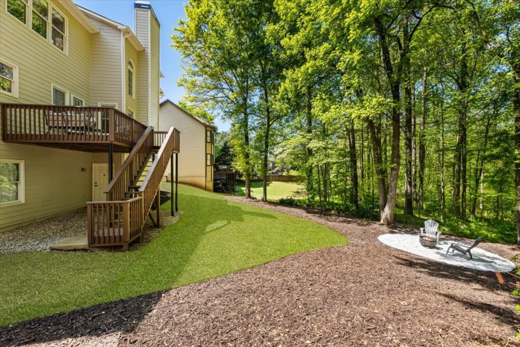 1110 Compass Pointe Crossing Alpharetta, GA 30005 - Photo 51 of 55 a view of a patio with a table and chairs