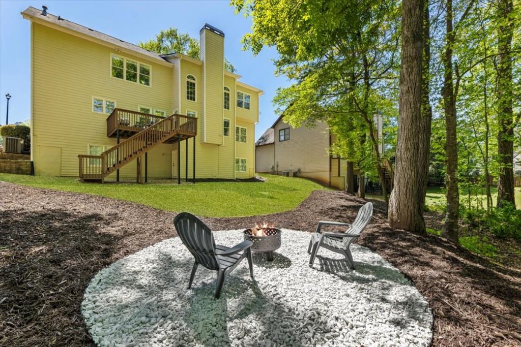 1110 Compass Pointe Crossing Alpharetta, GA 30005 - Photo 52 of 55 a view of a chairs in a backyard