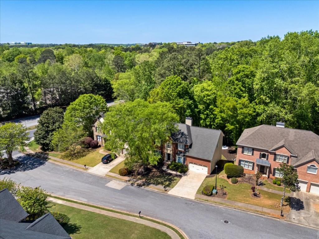 1110 Compass Pointe Crossing Alpharetta, GA 30005 - Photo 55 of 55 an aerial view of a house with a yard