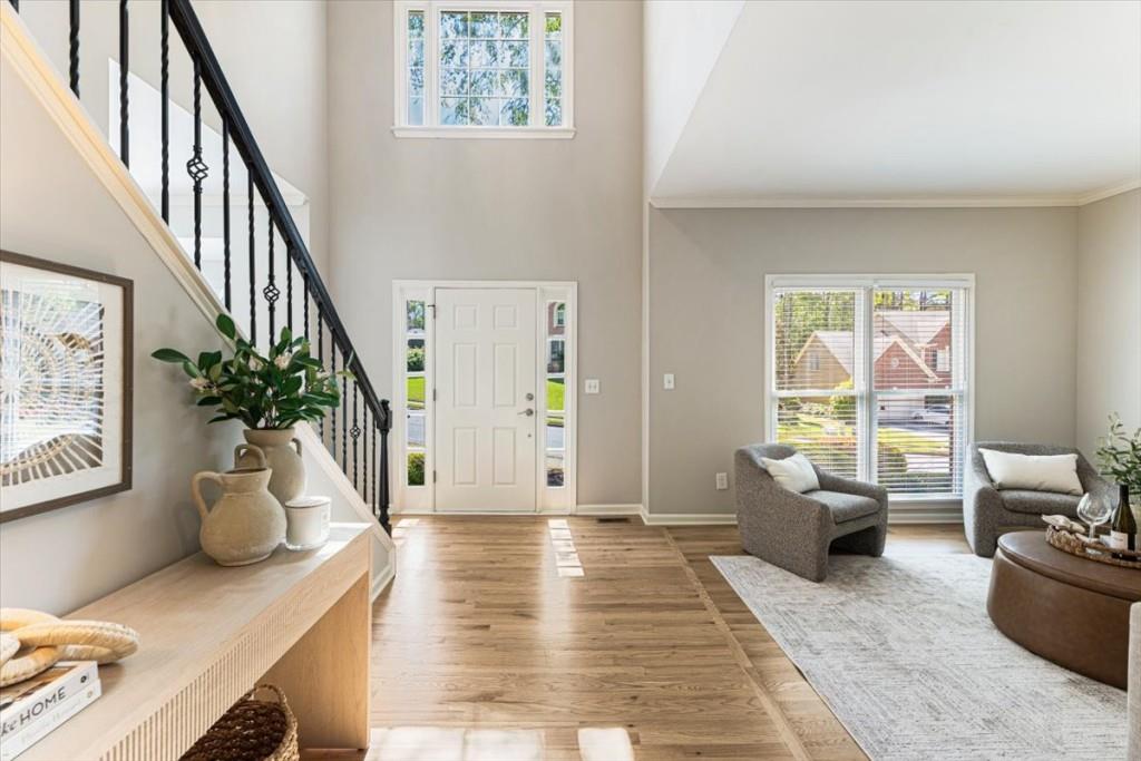 1110 Compass Pointe Crossing Alpharetta, GA 30005 - Photo 8 of 55 a living room with furniture and a potted plant