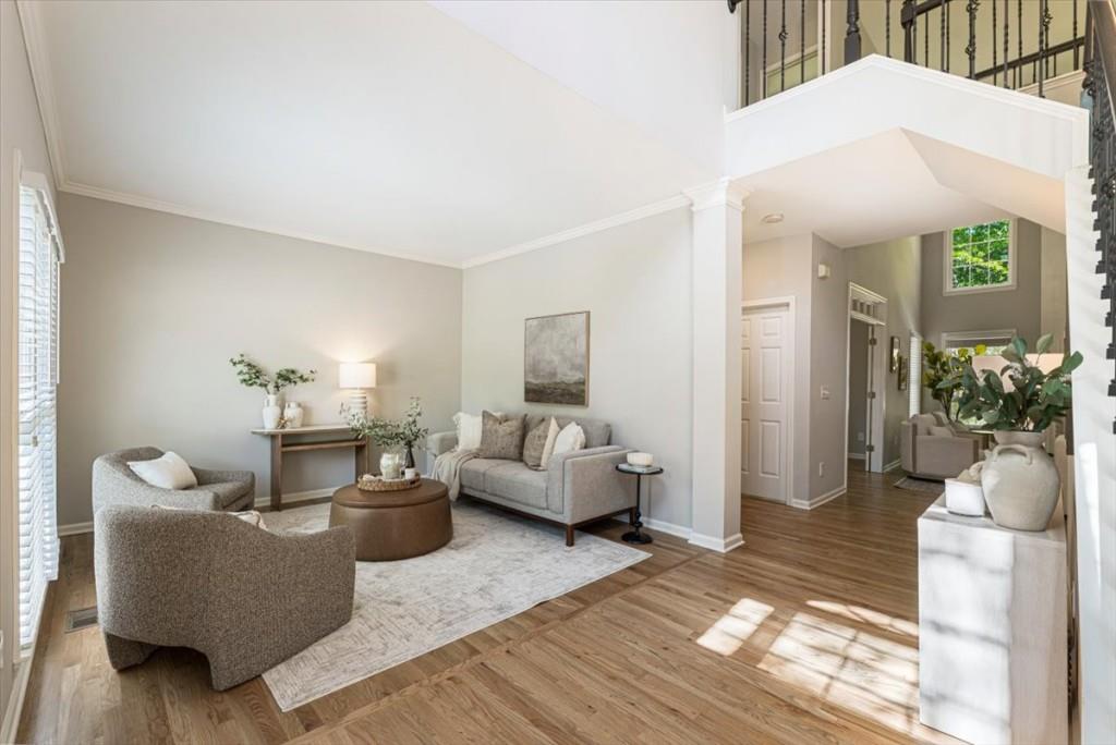 1110 Compass Pointe Crossing Alpharetta, GA 30005 - Photo 10 of 55 a living room with furniture and a couch