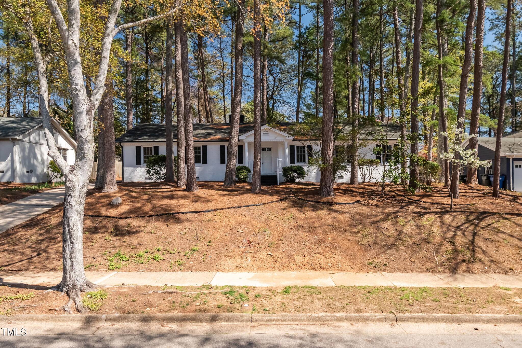 5812 Timber Ridge Drive Raleigh, NC 27609 - Photo 1 of 38 a building with trees in front of it