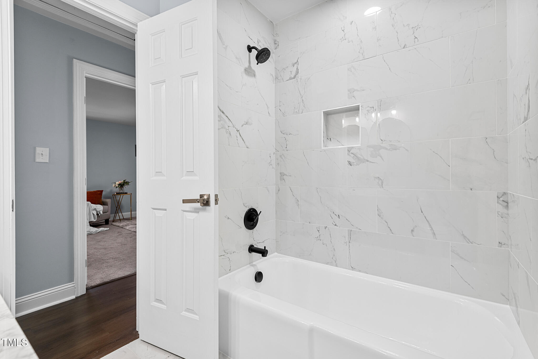 5812 Timber Ridge Drive Raleigh, NC 27609 - Photo 28 of 38 a bathroom with a bathtub and a shower