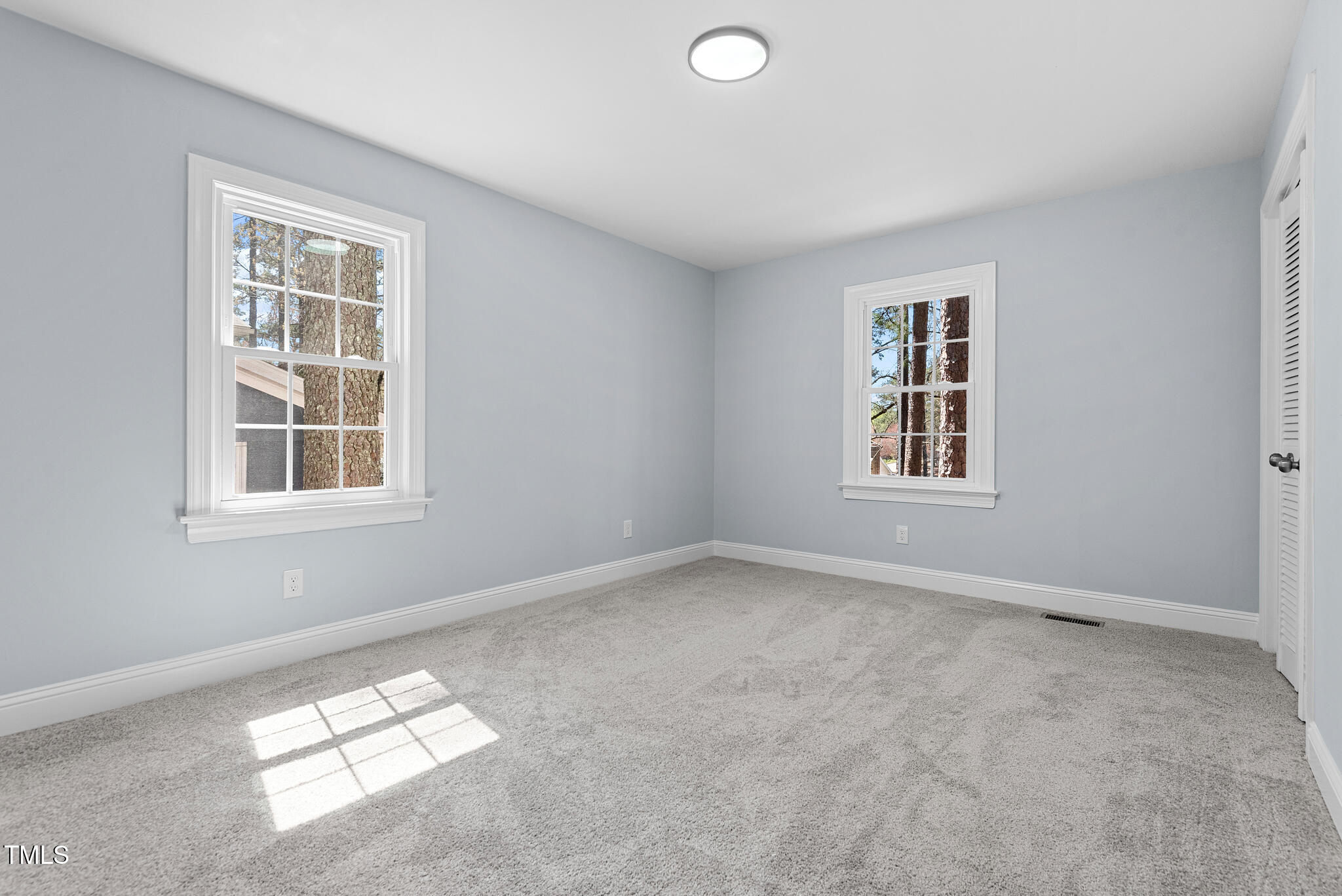 5812 Timber Ridge Drive Raleigh, NC 27609 - Photo 31 of 38 an empty room with a window