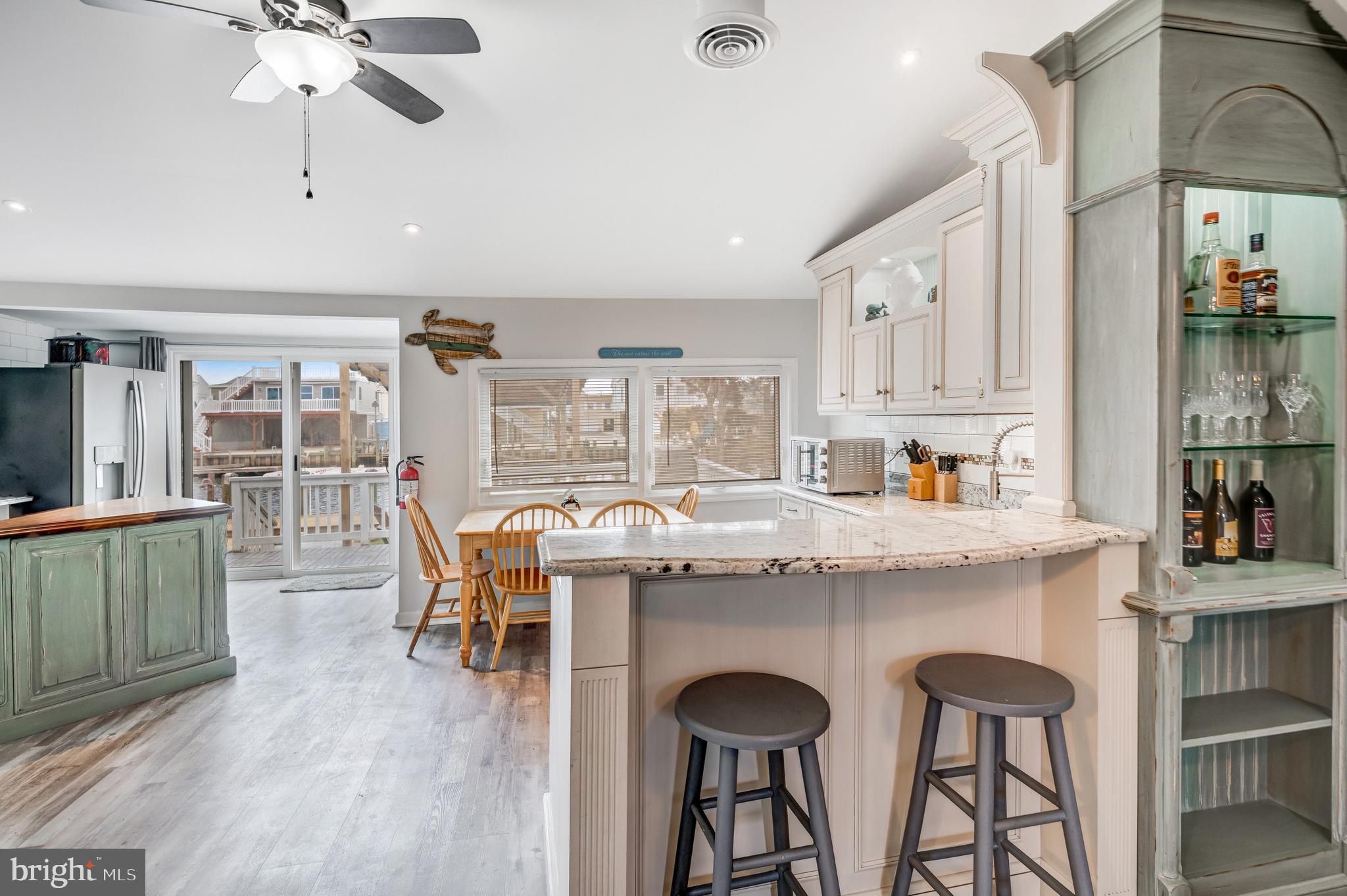 80 Dolphin Road Tuckerton, NJ 08087 - Photo 20 of 33 a view of a kitchen with furniture and wooden floor