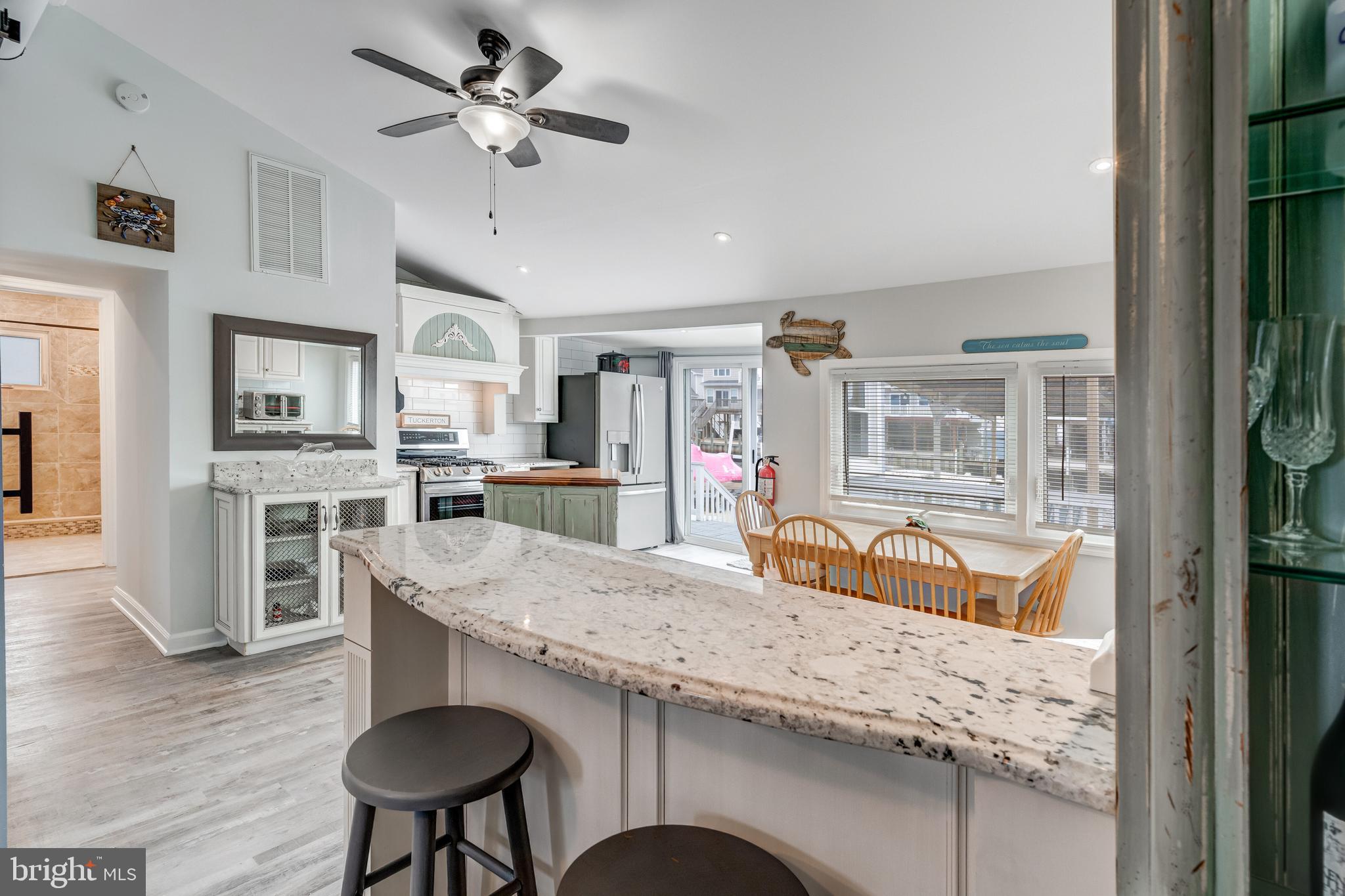 80 Dolphin Road Tuckerton, NJ 08087 - Photo 21 of 33 a kitchen with stainless steel appliances granite countertop a sink a stove and a refrigerator
