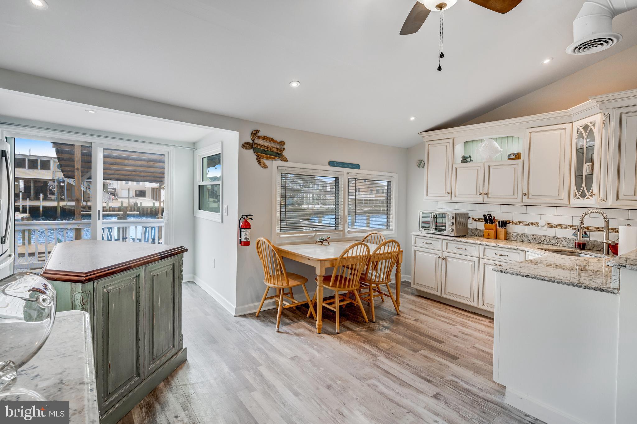 80 Dolphin Road Tuckerton, NJ 08087 - Photo 23 of 33 a kitchen with stainless steel appliances granite countertop a stove and a wooden floors