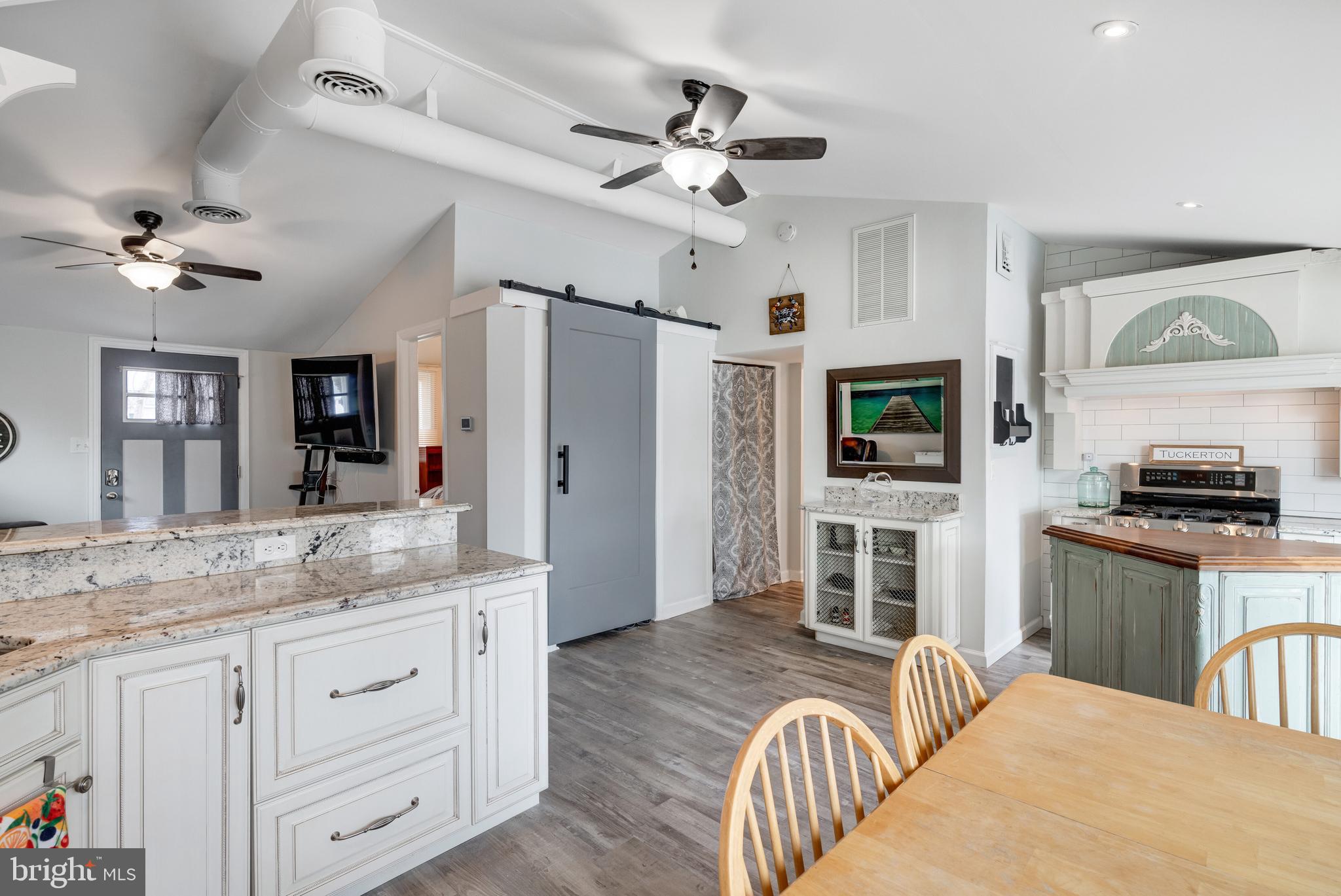 80 Dolphin Road Tuckerton, NJ 08087 - Photo 26 of 33 a kitchen with granite countertop stainless steel appliances a stove a sink cabinets and a refrigerator