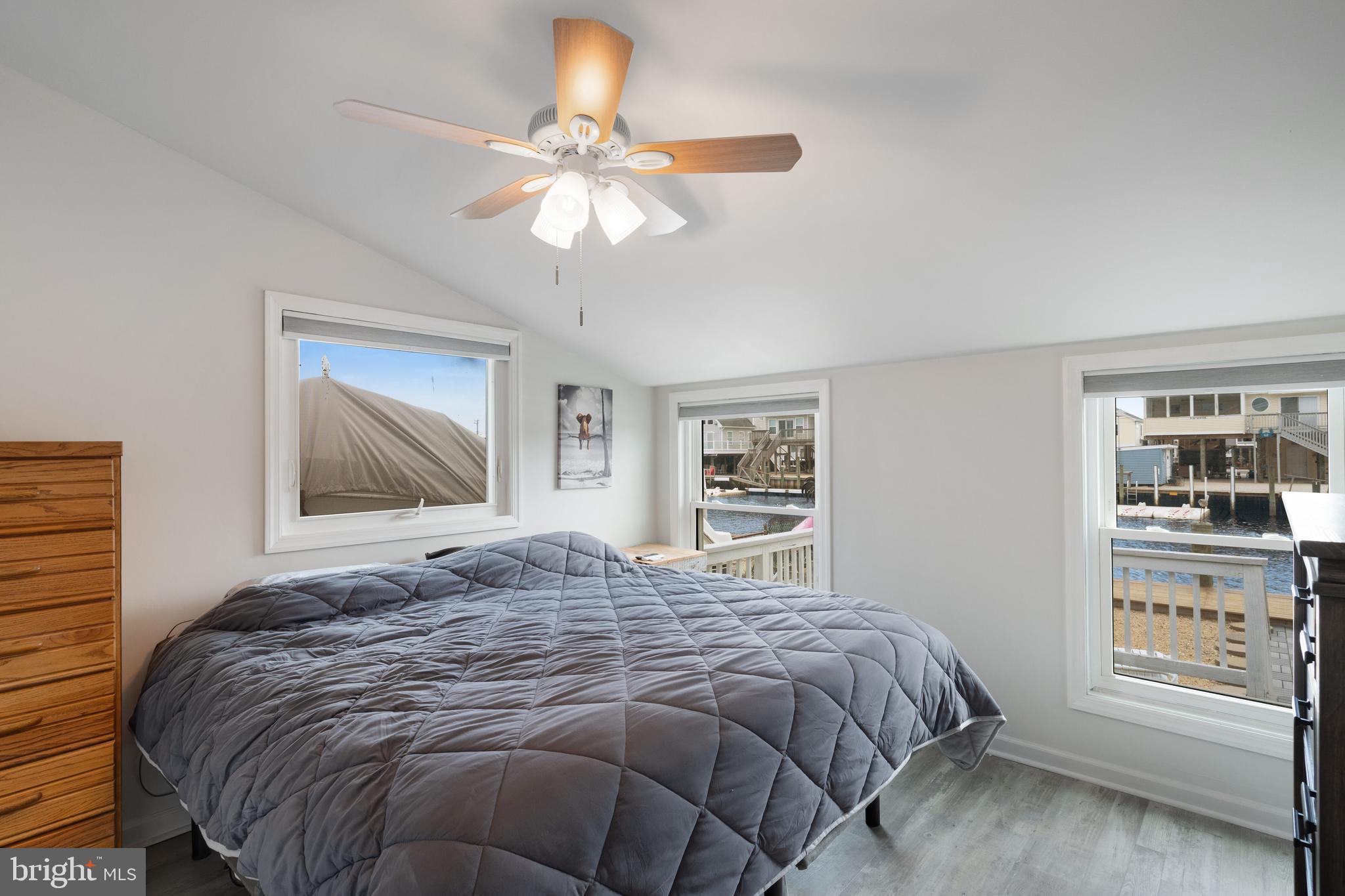 80 Dolphin Road Tuckerton, NJ 08087 - Photo 27 of 33 a bedroom with a large bed and a window