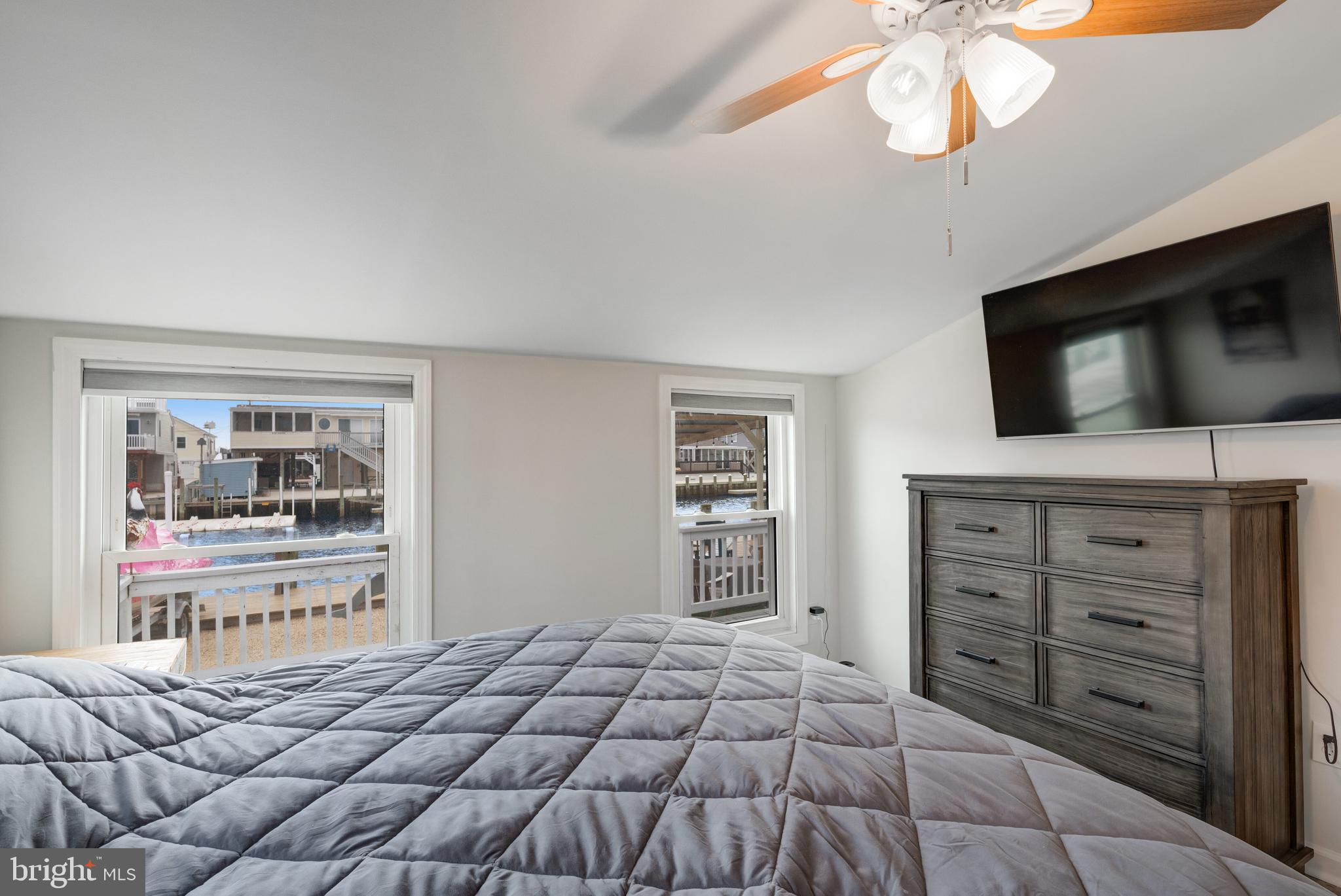 80 Dolphin Road Tuckerton, NJ 08087 - Photo 28 of 33 a bedroom with a bed and a television