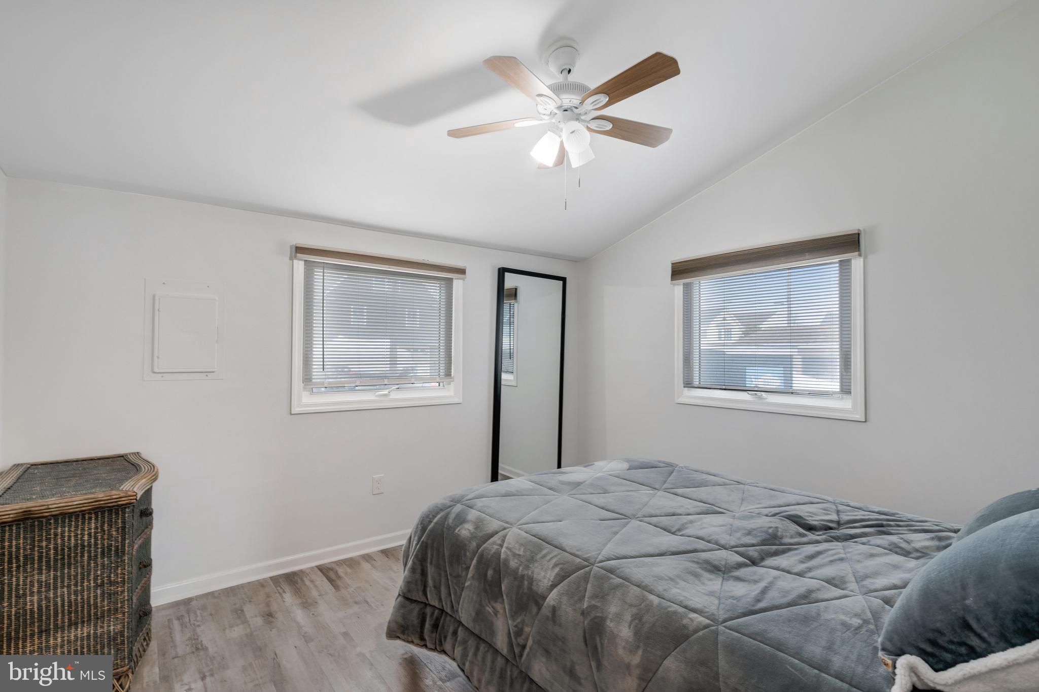 80 Dolphin Road Tuckerton, NJ 08087 - Photo 30 of 33 a bedroom with a large bed and a window