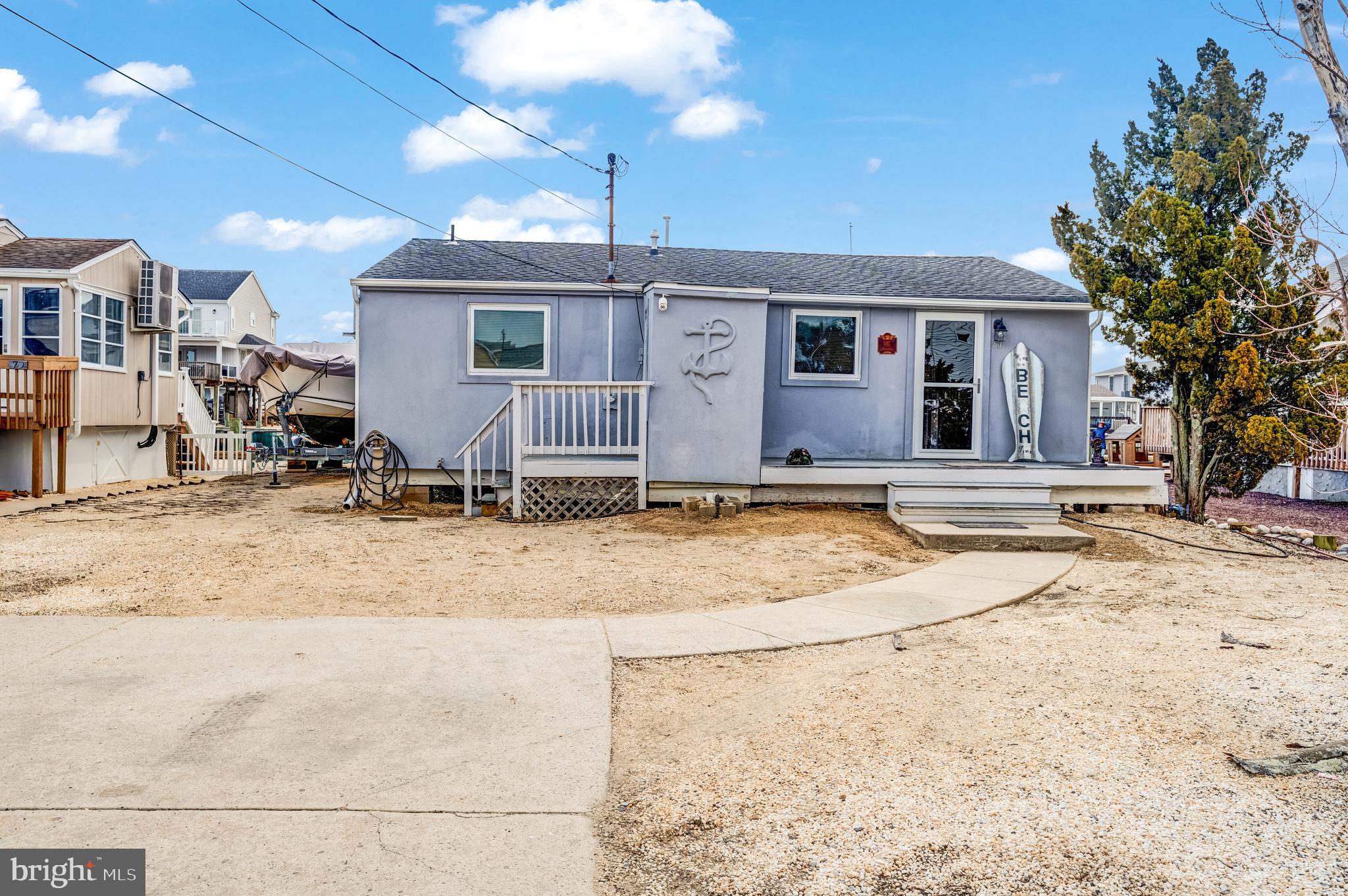 80 Dolphin Road Tuckerton, NJ 08087 - Photo 3 of 33 a view of a house with snow on the road