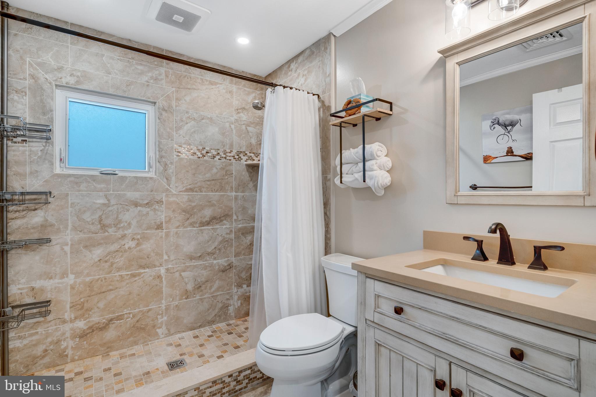 80 Dolphin Road Tuckerton, NJ 08087 - Photo 32 of 33 a bathroom with a sink a toilet and shower