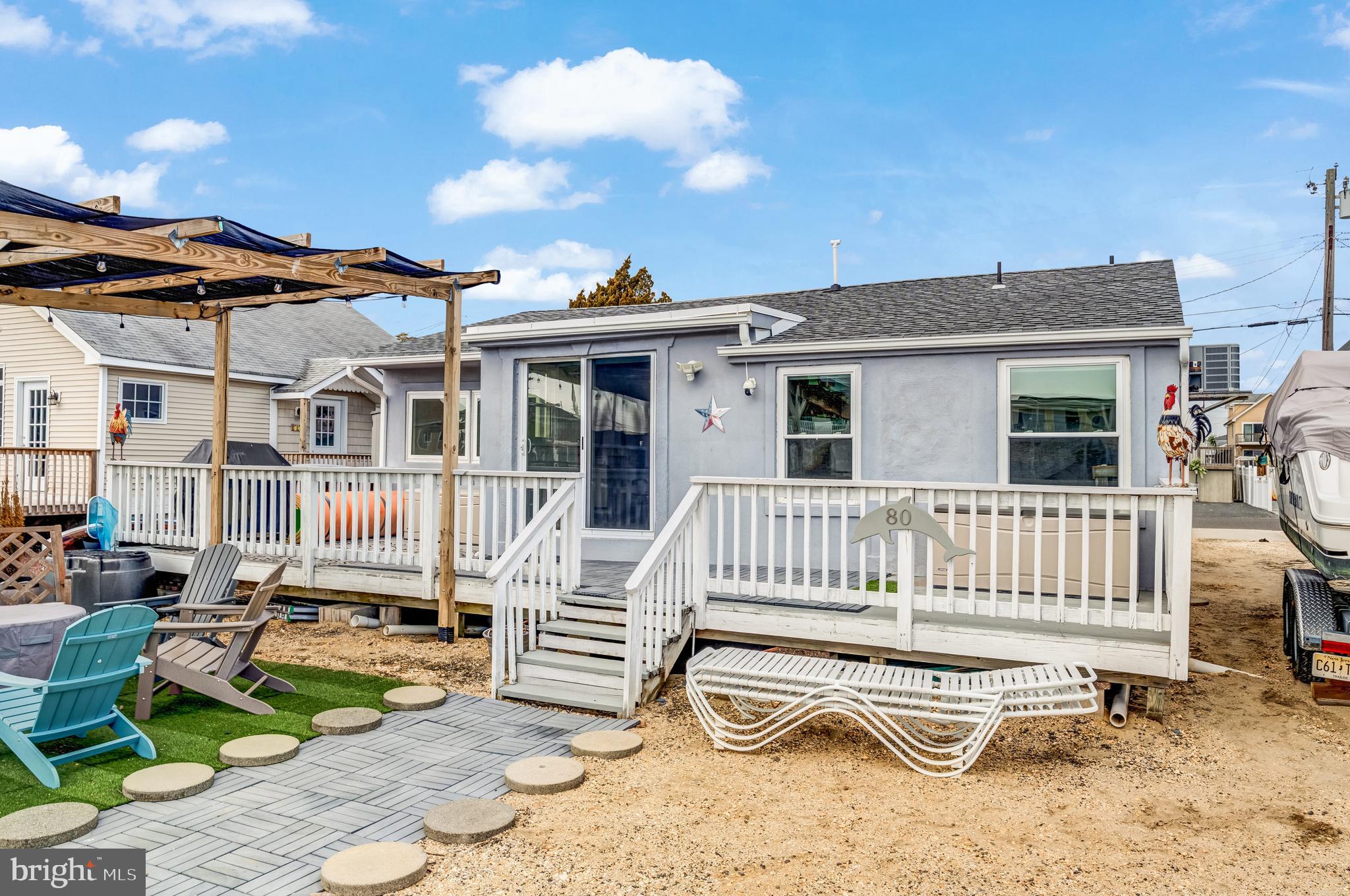 80 Dolphin Road Tuckerton, NJ 08087 - Photo 9 of 33 a view of a chair and tables in the patio