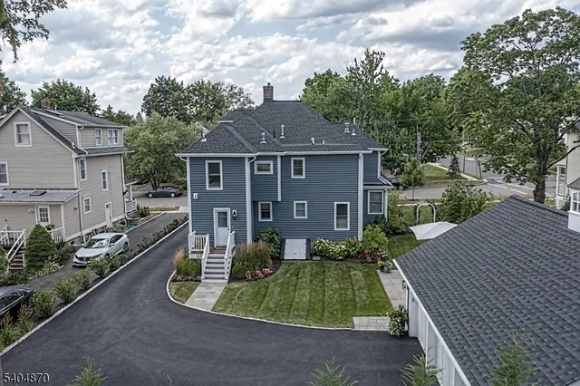a aerial view of a house with a yard