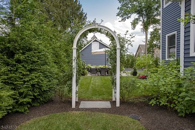 a view of a house with a small yard
