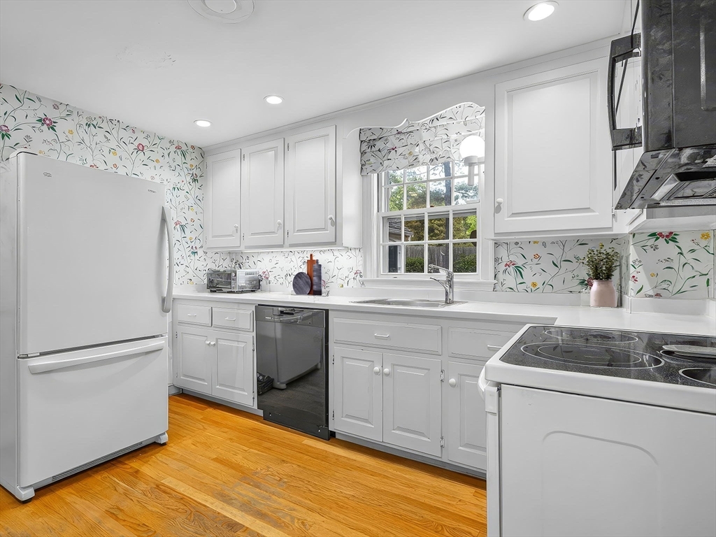45 Mayo Road Wellesley, MA 02482 - Photo 2 of 10 a kitchen with a sink stove and refrigerator