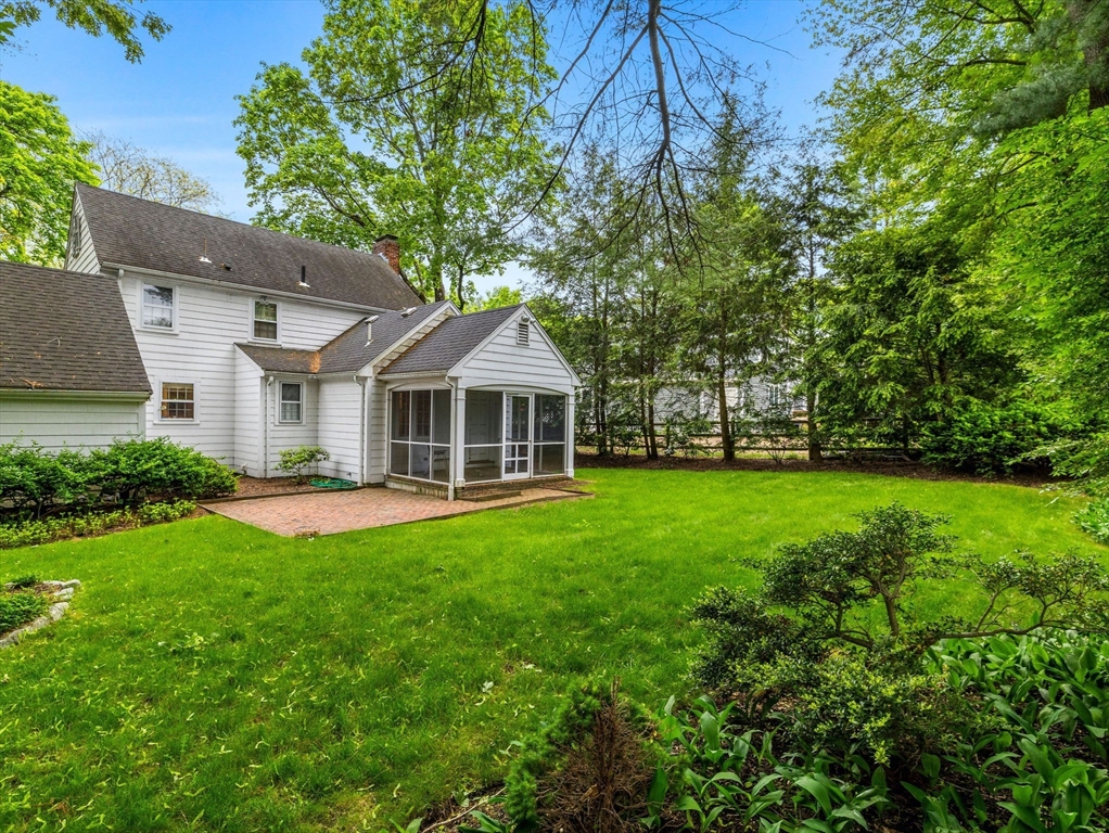 45 Mayo Road Wellesley, MA 02482 - Photo 9 of 10 a front view of a house with garden