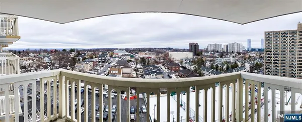 a view of a balcony with wooden floor