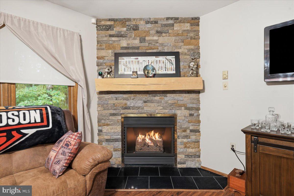 177 Jay Effort, PA 18330 - Photo 11 of 47 Cozy stone fireplace with warm ambiance.