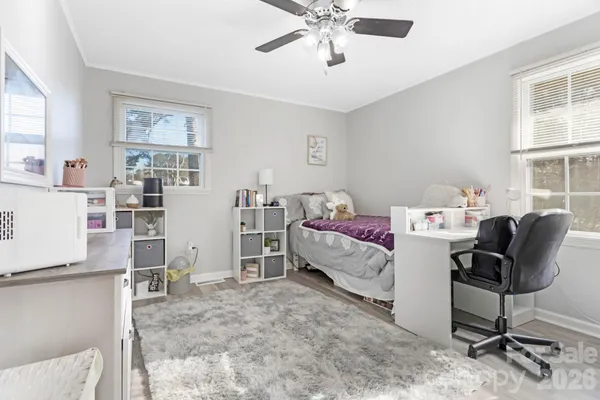a bedroom with furniture and a window