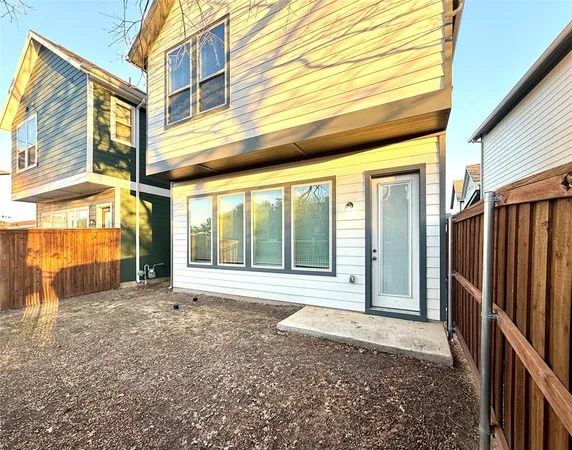 an aerial view of multiple house with yard
