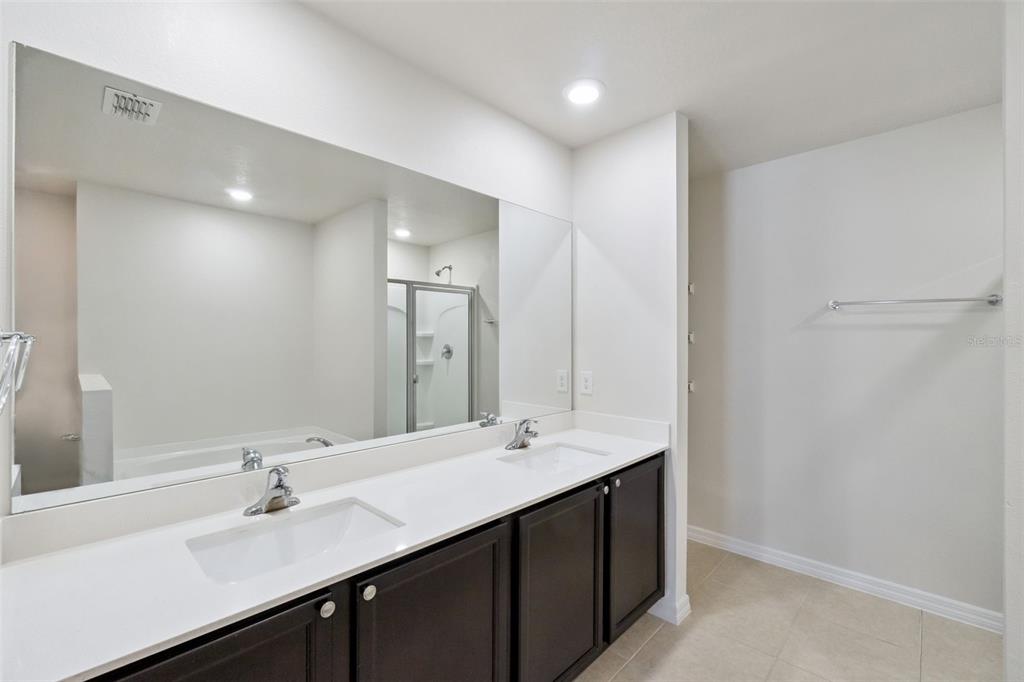 1729 Canaan Loop Dundee, FL 33838 - Photo 18 of 33 a bathroom with a sink and a mirror