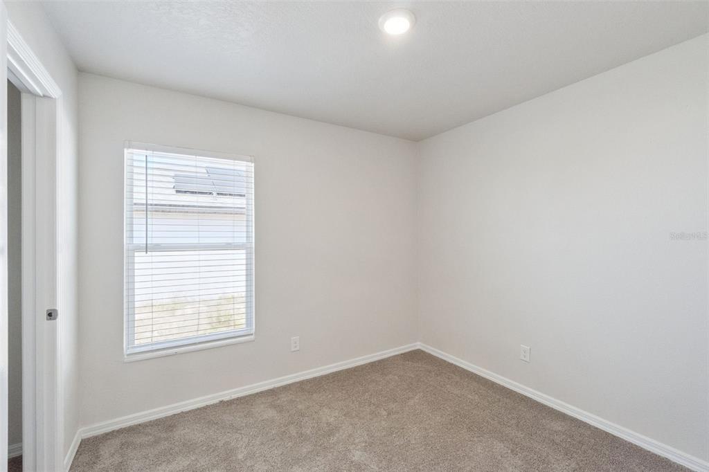 1729 Canaan Loop Dundee, FL 33838 - Photo 20 of 33 an empty room with a window