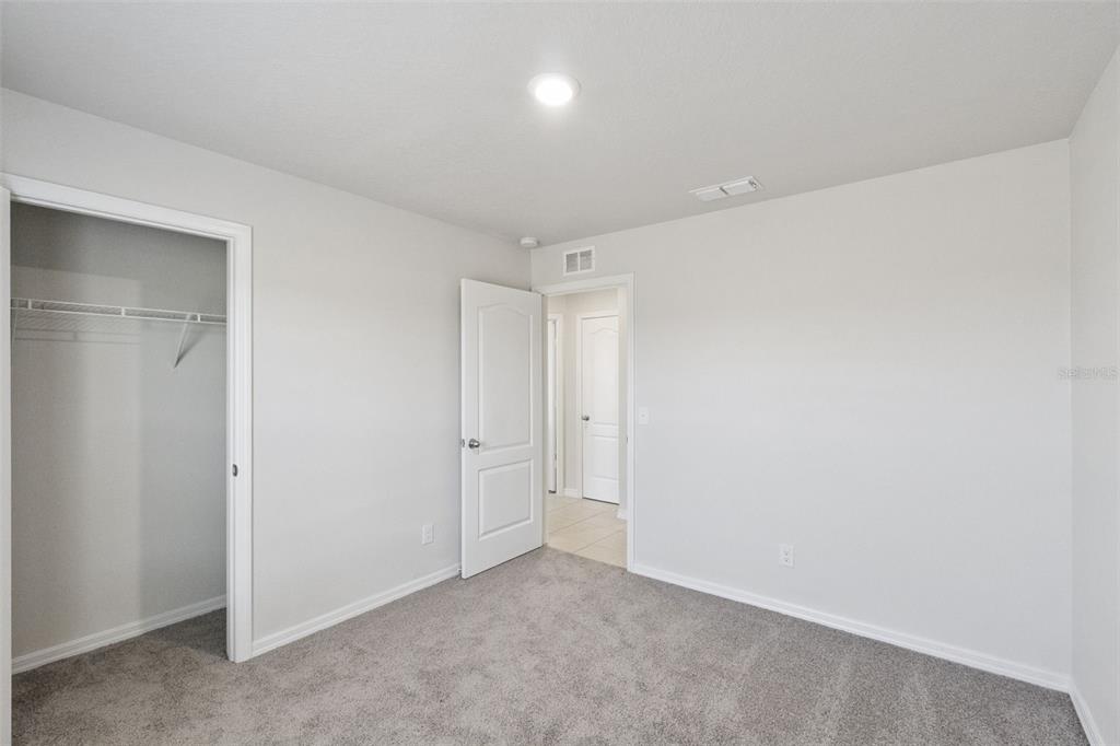 1729 Canaan Loop Dundee, FL 33838 - Photo 21 of 33 a view of an empty room