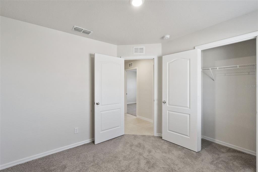 1729 Canaan Loop Dundee, FL 33838 - Photo 24 of 33 an empty room with closet area
