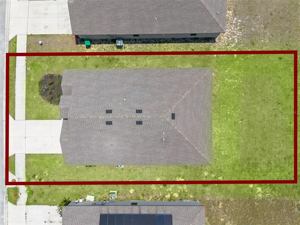 1729 Canaan Loop Dundee, FL 33838 - Photo 31 of 33 a view of a swimming pool with a yard