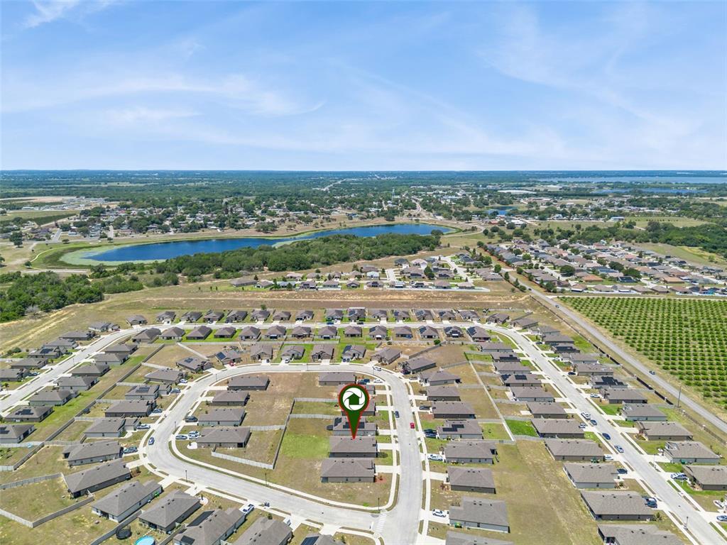 1729 Canaan Loop Dundee, FL 33838 - Photo 33 of 33 an aerial view of a city with lots of residential buildings
