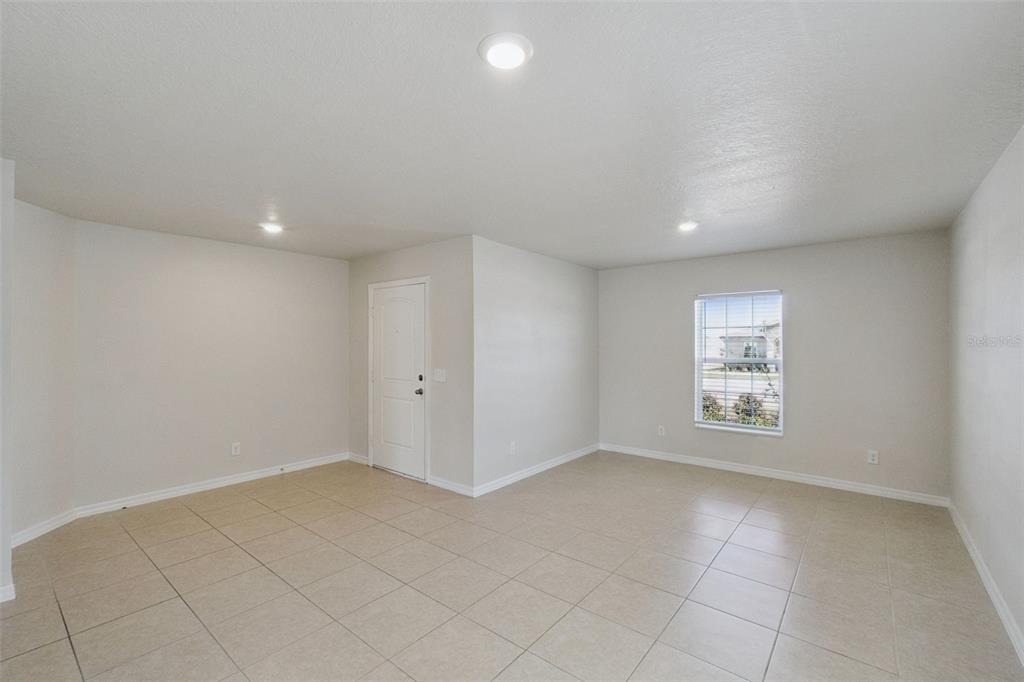 1729 Canaan Loop Dundee, FL 33838 - Photo 4 of 33 a view of an empty room with a window