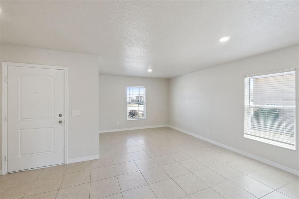 1729 Canaan Loop Dundee, FL 33838 - Photo 5 of 33 a view of an empty room with a window
