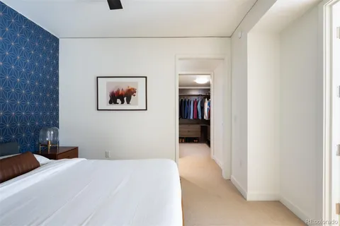 a bedroom with a bed and a view of bathroom