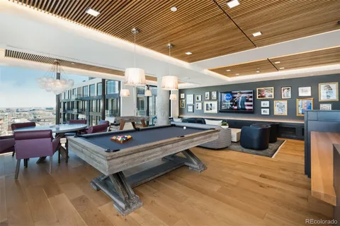a large kitchen with stainless steel appliances a large counter top